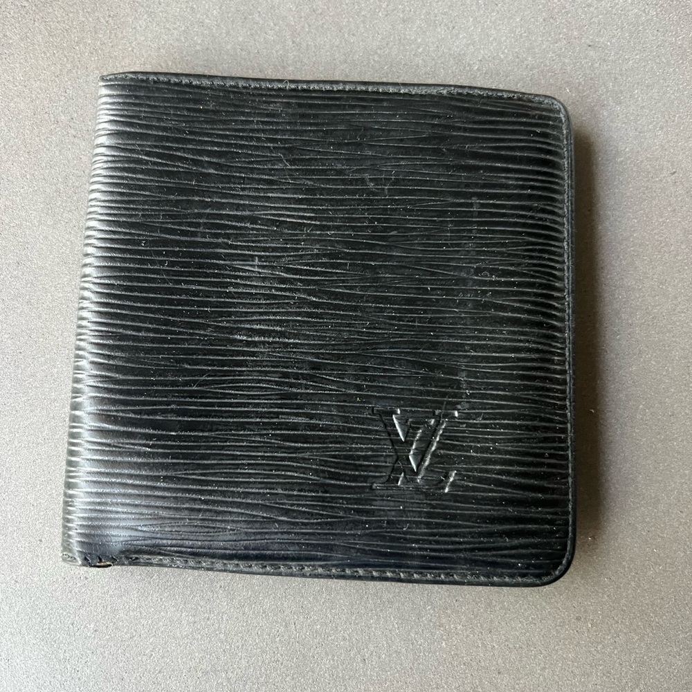 Louis Vuitton vintage black epi leather wallet.